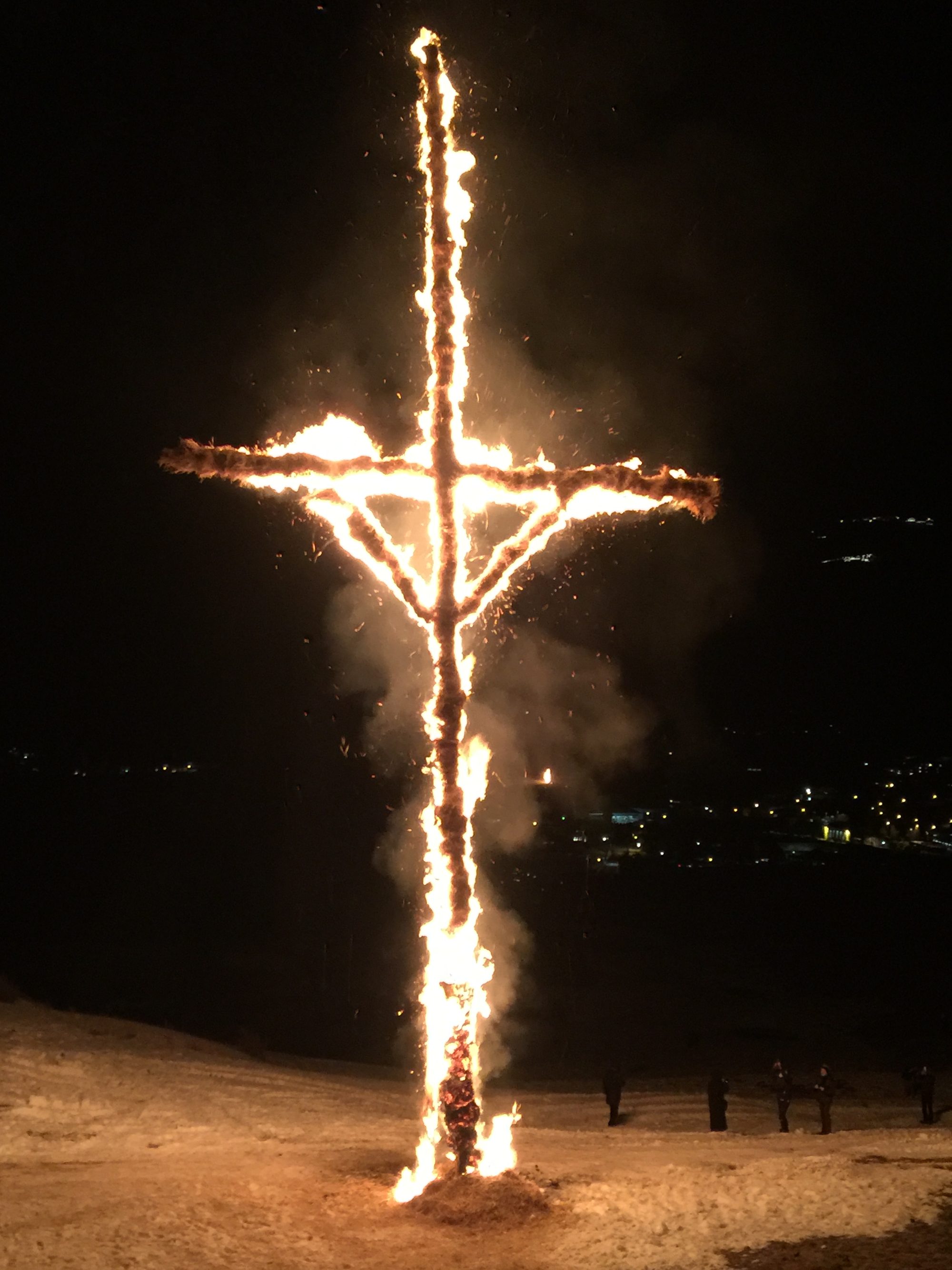 Scheibenschlagen: a burning wooden disc at night